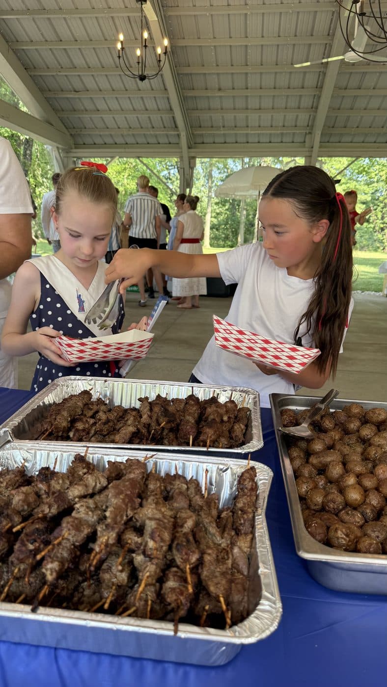 Children at the food table at the picnic