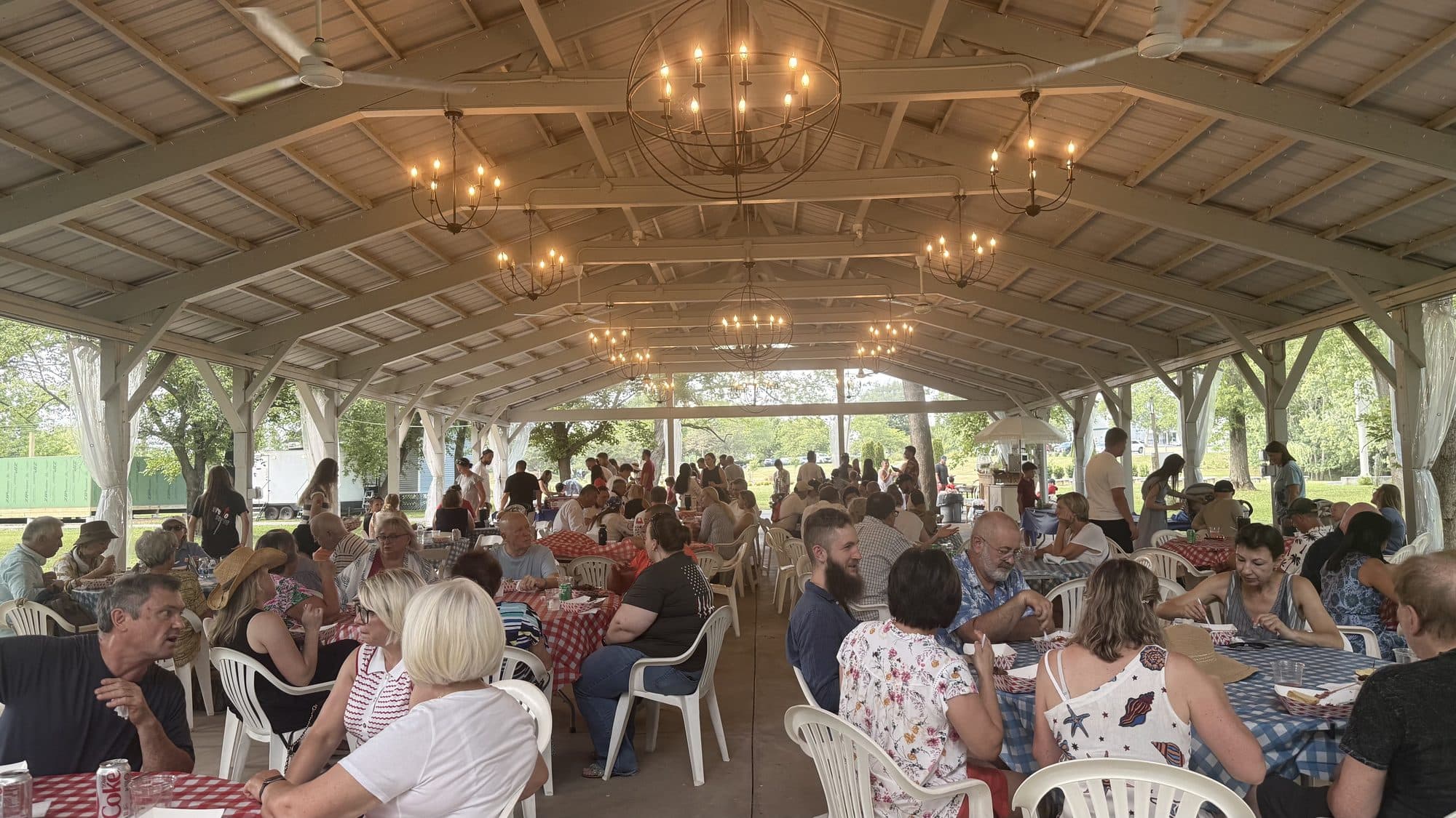 Church members gathered around the picnic tables