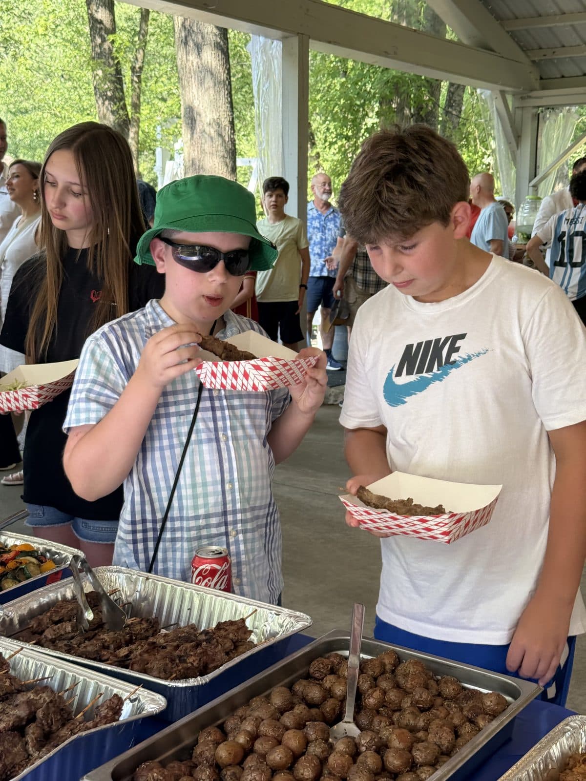 Children sharing a meal together at the picnic table