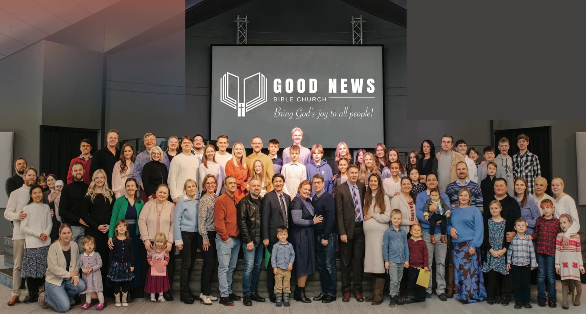 The Good News Bible Church family together in the sanctuary