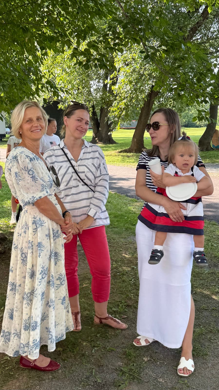 Families chatting together at a past church picnic