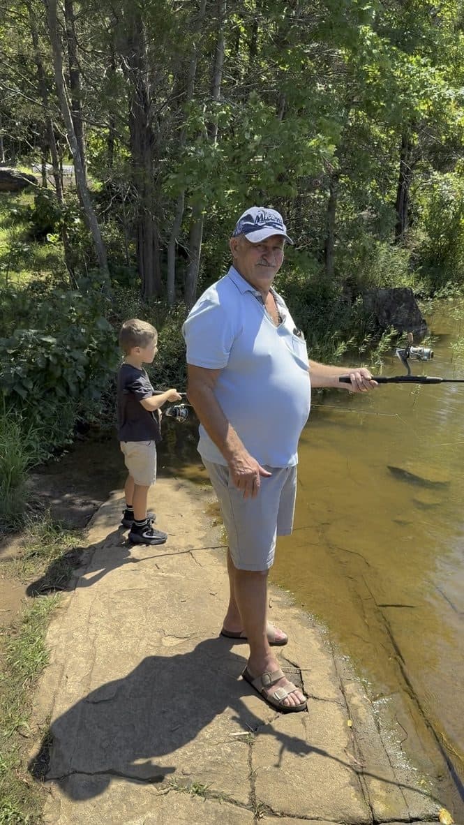 Fishing by the water near the picnic
