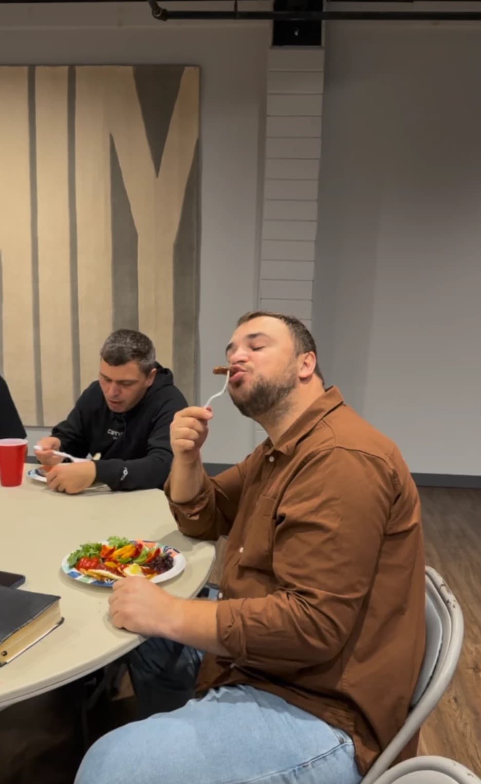 A brother enjoying breakfast at the table